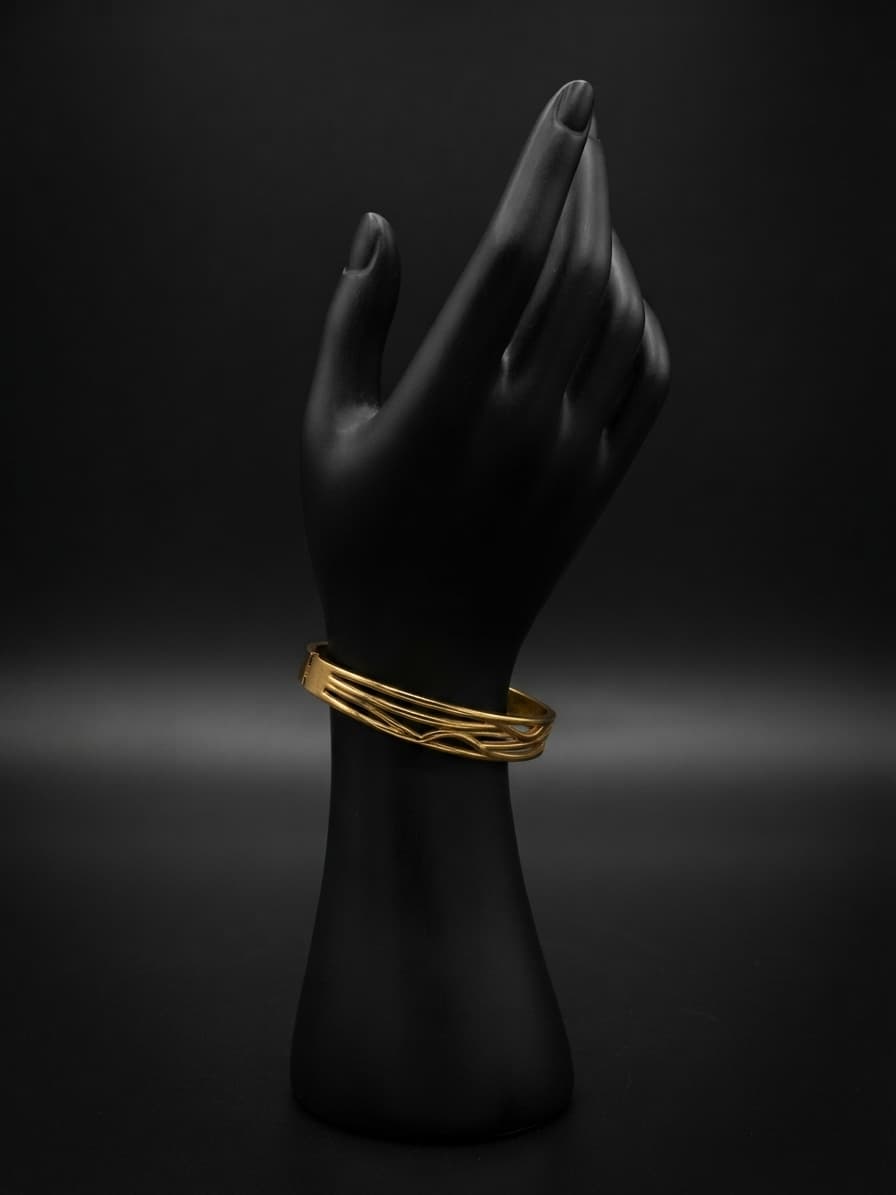Pulsera mediana de acero dorado con olas